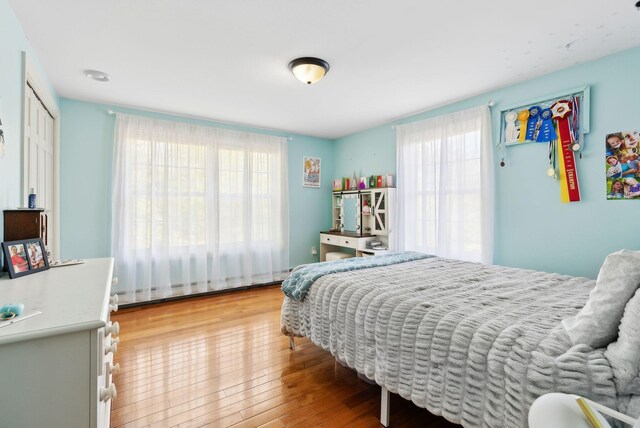 17 S Rd, Winthrop, ME 04364 - bedroom with multiple windows, light wood finished floors, and baseboard heating