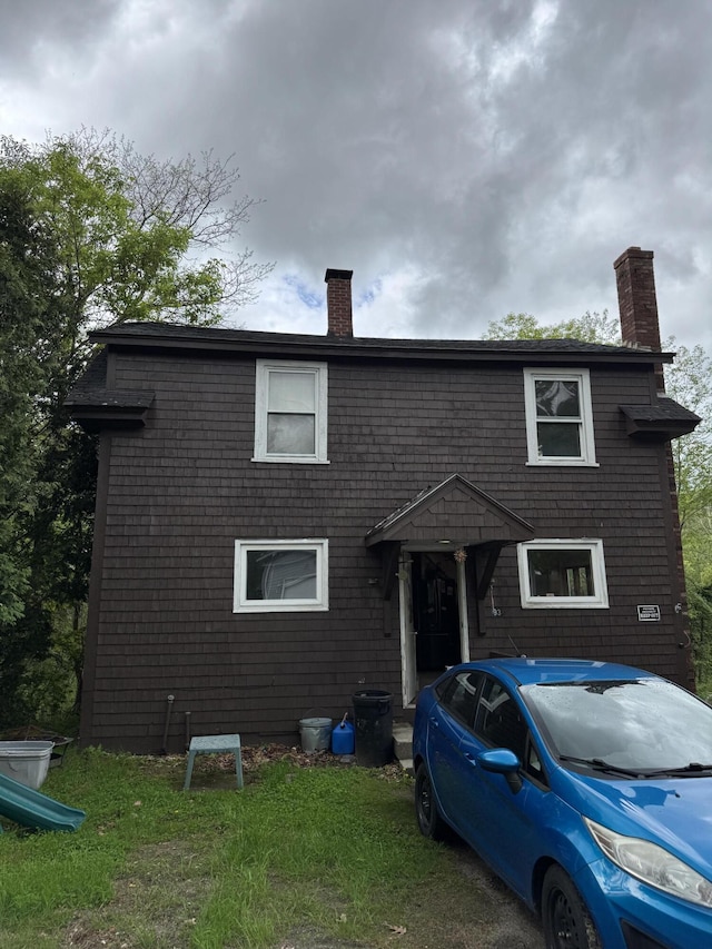 view of front of home with a chimney