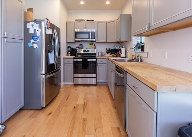 67 Hamilton Hill Way, Bar Harbor, ME 04609 - kitchen with stainless steel appliances, a sink, gray cabinetry, light wood finished floors, and recessed lighting