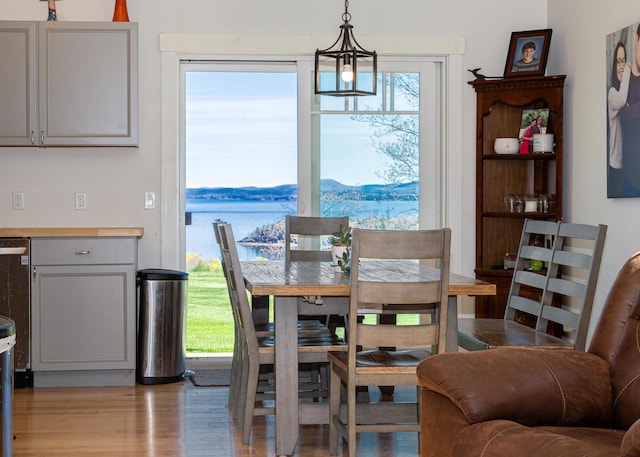67 Hamilton Hill Way, Bar Harbor, ME 04609 - dining room with a chandelier and light wood-type flooring