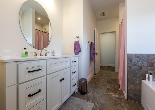 67 Hamilton Hill Way, Bar Harbor, ME 04609 - full bath featuring vanity, stone finish floors, and a tub to relax in