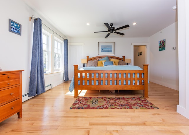 67 Hamilton Hill Way, Bar Harbor, ME 04609 - bedroom featuring wood finished floors, baseboard heating, recessed lighting, ceiling fan, and baseboards