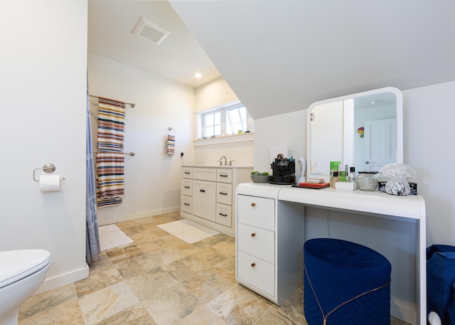 67 Hamilton Hill Way, Bar Harbor, ME 04609 - full bathroom with vanity, stone finish floors, baseboards, and toilet