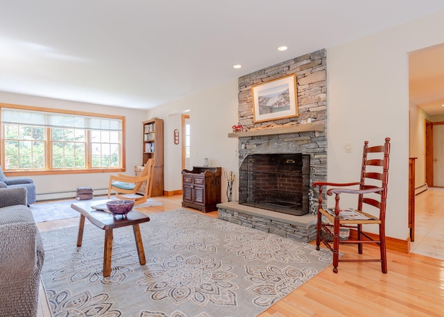 20 Ocean Side Ln, Bristol, ME 04554 - living room featuring wood finished floors, a stone fireplace, recessed lighting, and baseboard heating