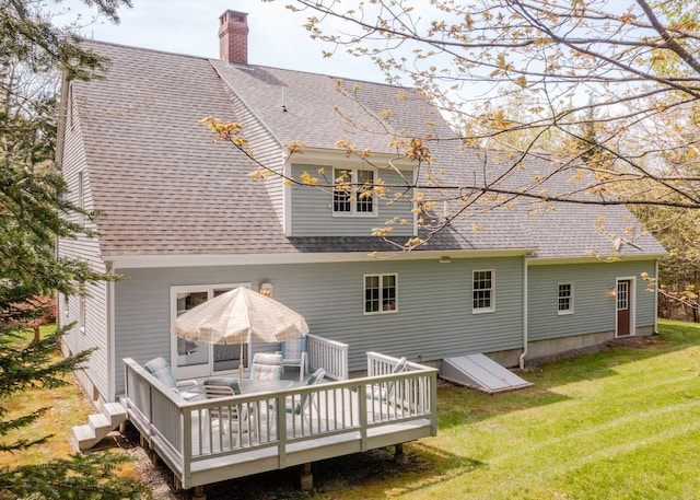 20 Ocean Side Ln, Bristol, ME 04554 - rear view of house with a shingled roof, a lawn, a deck, and a chimney