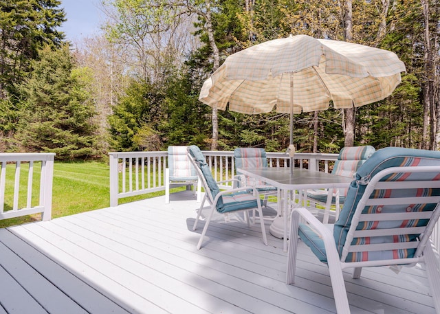 20 Ocean Side Ln, Bristol, ME 04554 - wooden deck featuring outdoor dining area and a yard