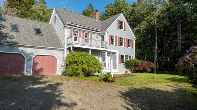 20 Ocean Side Ln, Bristol, ME 04554 - view of front facade with a balcony, driveway, a chimney, a shingled roof, and a front lawn