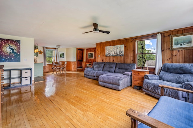 206 Sebago Lake Rd, Gorham, ME 04038 - living area featuring a ceiling fan, wood walls, and light wood finished floors