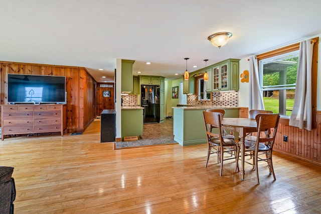 206 Sebago Lake Rd, Gorham, ME 04038 - dining room featuring light wood-style flooring, wooden walls, and recessed lighting