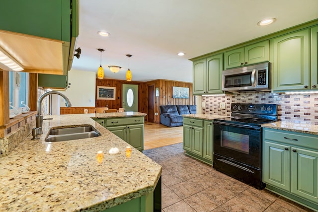 206 Sebago Lake Rd, Gorham, ME 04038 - kitchen with stainless steel microwave, black range with electric stovetop, green cabinetry, a sink, and recessed lighting
