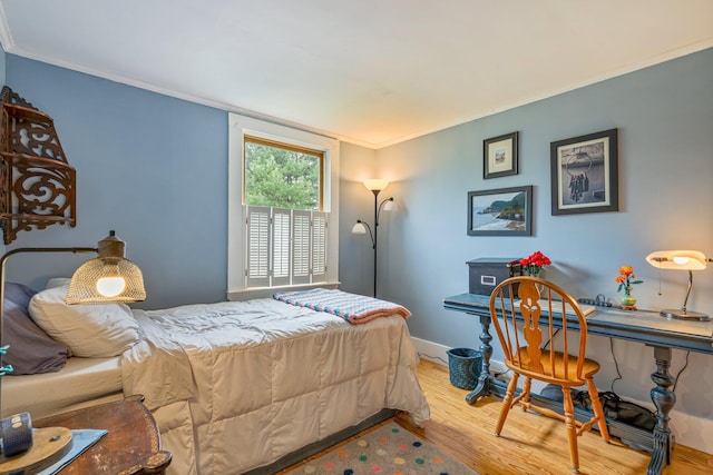 206 Sebago Lake Rd, Gorham, ME 04038 - bedroom featuring wood finished floors, ornamental molding, baseboards, and a desk