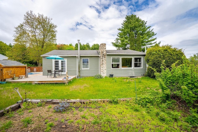 206 Sebago Lake Rd, Gorham, ME 04038 - back of house with a deck, a chimney, and a yard