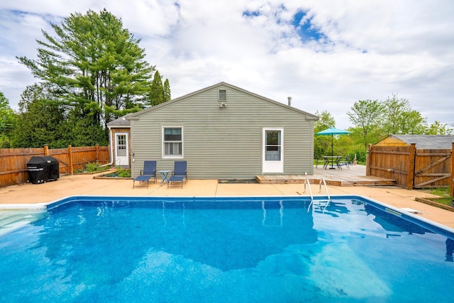 206 Sebago Lake Rd, Gorham, ME 04038 - view of swimming pool featuring a deck, a fenced backyard, and a patio area