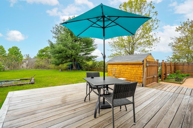 206 Sebago Lake Rd, Gorham, ME 04038 - wooden deck featuring outdoor dining area and a playground