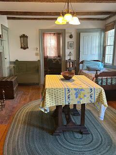 15 River Rd, Phillips, ME 04966 - dining space with beamed ceiling, wood finished floors, and a chandelier