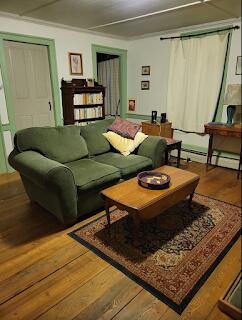 15 River Rd, Phillips, ME 04966 - living area with baseboard heating and hardwood / wood-style floors