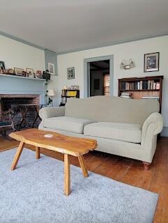 15 River Rd, Phillips, ME 04966 - living area featuring a fireplace and wood finished floors