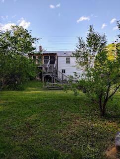 15 River Rd, Phillips, ME 04966 - back of property featuring stairway and a lawn