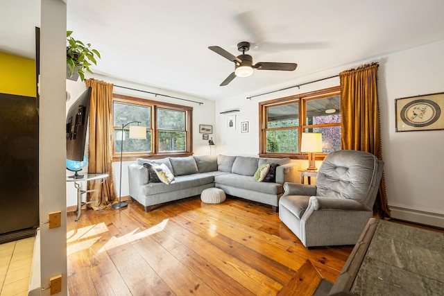 35 Salem Towne Rd, Southwest Harbor, ME 04679 - living room featuring a ceiling fan, plenty of natural light, light wood-type flooring, and a baseboard radiator