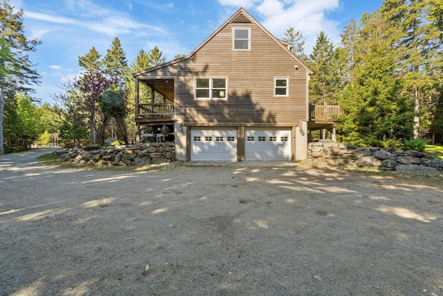 35 Salem Towne Rd, Southwest Harbor, ME 04679 - view of home's exterior featuring a garage, driveway, and a wooden deck