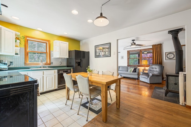 35 Salem Towne Rd, Southwest Harbor, ME 04679 - dining space featuring ceiling fan, light wood-style floors, recessed lighting, and a wood stove