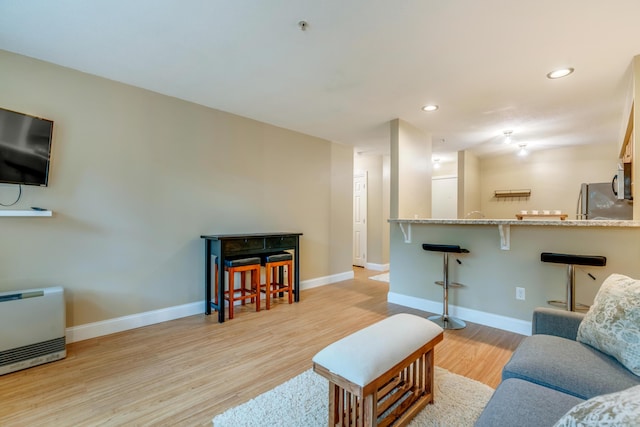 18 Smithwheel Rd Unit 21, Old Orchard Beach, ME 04064 - living area with wood finished floors, baseboards, and recessed lighting