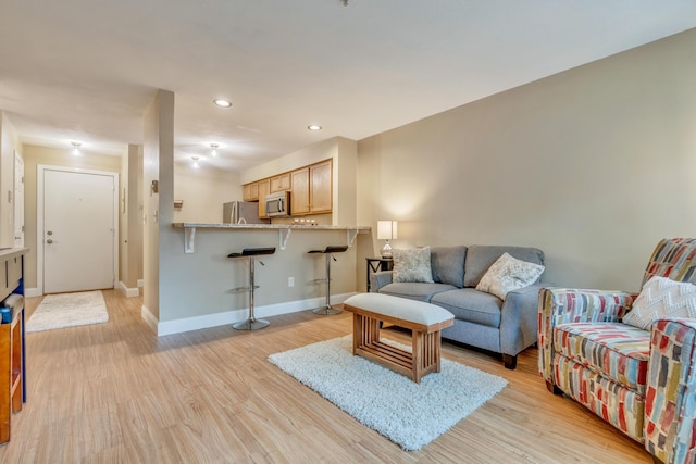 18 Smithwheel Rd Unit 21, Old Orchard Beach, ME 04064 - living room featuring light wood-style floors, baseboards, and recessed lighting