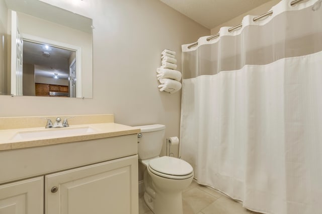 18 Smithwheel Rd Unit 21, Old Orchard Beach, ME 04064 - full bathroom featuring tile patterned flooring, vanity, toilet, and a shower with shower curtain