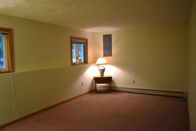 96 Pamela Dr, Winthrop, ME 04364 - carpeted spare room with electric panel, a textured ceiling, a baseboard radiator, and baseboards