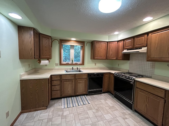 96 Pamela Dr, Winthrop, ME 04364 - kitchen featuring black appliances, a sink, under cabinet range hood, light countertops, and a textured ceiling