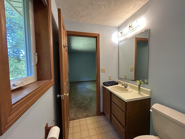 96 Pamela Dr, Winthrop, ME 04364 - bathroom featuring vanity, a textured ceiling, toilet, and tile patterned floors