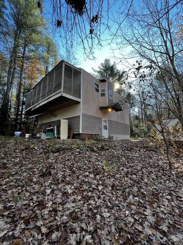 371 Carding Machine Rd, Bowdoinham, ME 04008 - view of side of home featuring a sunroom