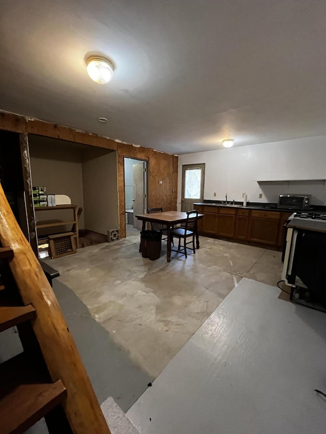 371 Carding Machine Rd, Bowdoinham, ME 04008 - dining room featuring unfinished concrete flooring and bar area