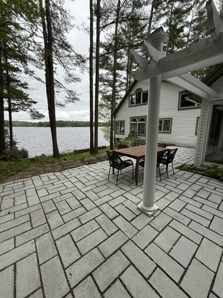 27 Chickadee Ln, Naples, ME 04055 - view of patio featuring outdoor dining space and a water view