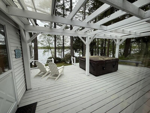 27 Chickadee Ln, Naples, ME 04055 - wooden terrace featuring a covered hot tub, a water view, and a pergola