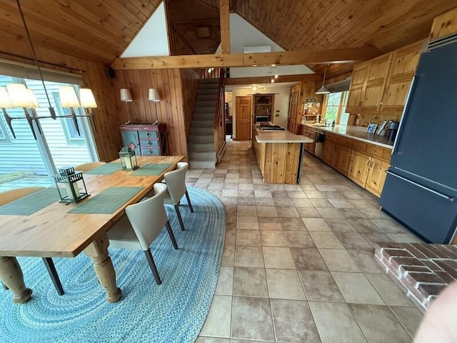 27 Chickadee Ln, Naples, ME 04055 - dining area featuring wooden walls, lofted ceiling, wooden ceiling, and stairs