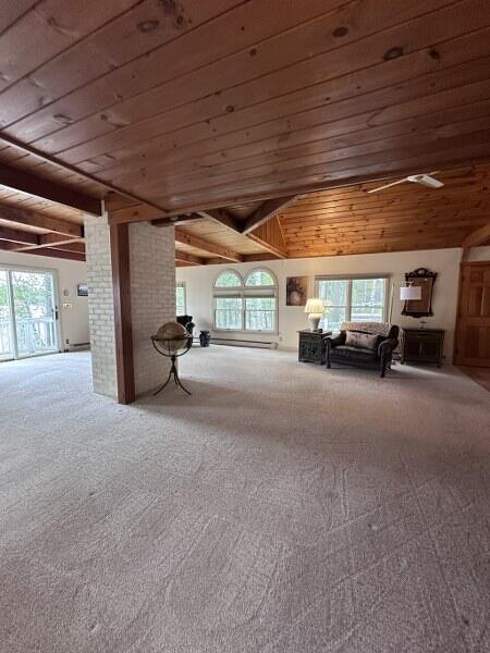 27 Chickadee Ln, Naples, ME 04055 - living area featuring wooden ceiling and carpet floors