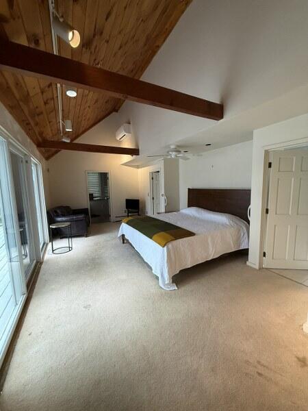 27 Chickadee Ln, Naples, ME 04055 - carpeted bedroom featuring a wall unit AC, wood ceiling with exposed beams, and high vaulted ceiling