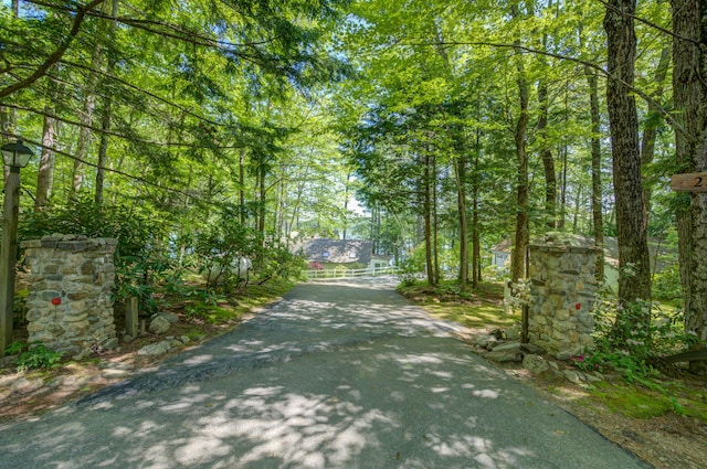 27 Chickadee Ln, Naples, ME 04055 - view of asphalt driveway with a gated entry