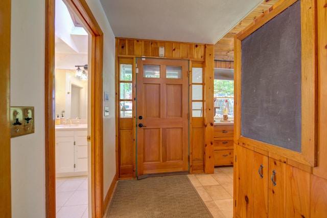 27 Chickadee Ln, Naples, ME 04055 - entrance foyer with light tile patterned floors and healthy amount of natural light