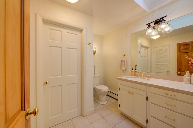 27 Chickadee Ln, Naples, ME 04055 - bathroom featuring tile patterned floors, a baseboard radiator, vanity, and toilet