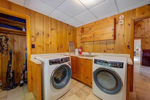 27 Chickadee Ln, Naples, ME 04055 - laundry area with washer and dryer, wooden walls, and light tile patterned flooring