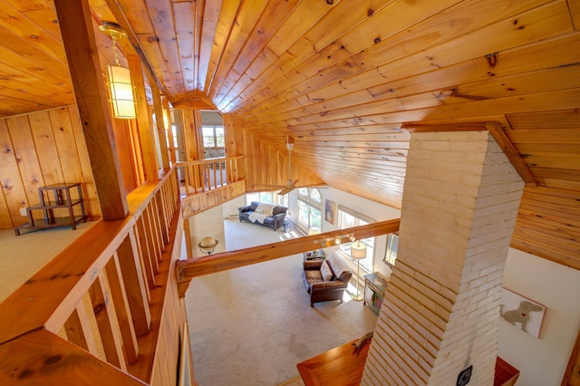 27 Chickadee Ln, Naples, ME 04055 - staircase featuring wood ceiling, wooden walls, carpet floors, and vaulted ceiling