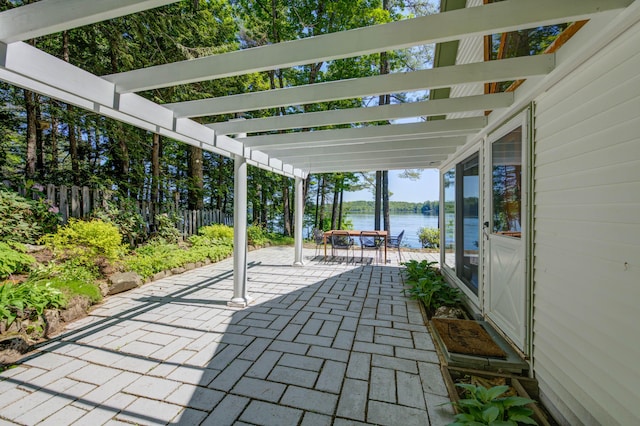 27 Chickadee Ln, Naples, ME 04055 - view of patio / terrace featuring a water view, a pergola, and outdoor dining space