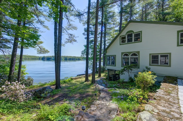 27 Chickadee Ln, Naples, ME 04055 - view of home's exterior with a water view