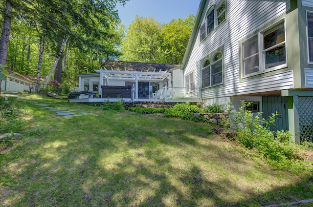27 Chickadee Ln, Naples, ME 04055 - view of grassy yard with a deck and a hot tub