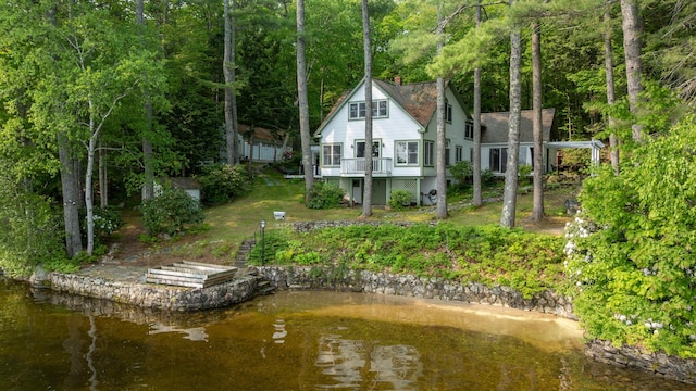 27 Chickadee Ln, Naples, ME 04055 - back of property with a chimney and a wooden deck