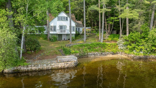 27 Chickadee Ln, Naples, ME 04055 - rear view of property featuring a chimney, a forest view, and a water view