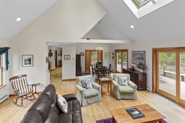68 Parker Farm Rd, Mount Desert, ME 04660 - living area featuring a chandelier, healthy amount of natural light, high vaulted ceiling, a skylight, and light wood-type flooring