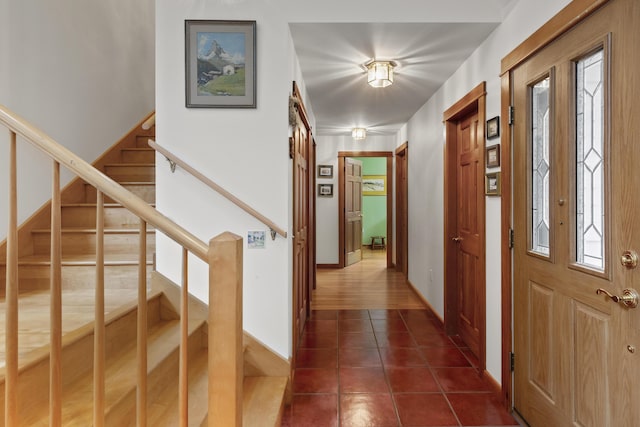 68 Parker Farm Rd, Mount Desert, ME 04660 - foyer entrance with stairway, dark tile patterned flooring, plenty of natural light, and baseboards